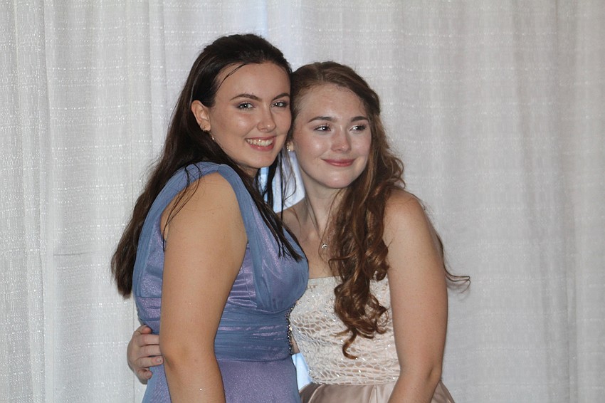 Braden River High School juniors Sarah Williamson and Madelynn Buckley hang out at prom.