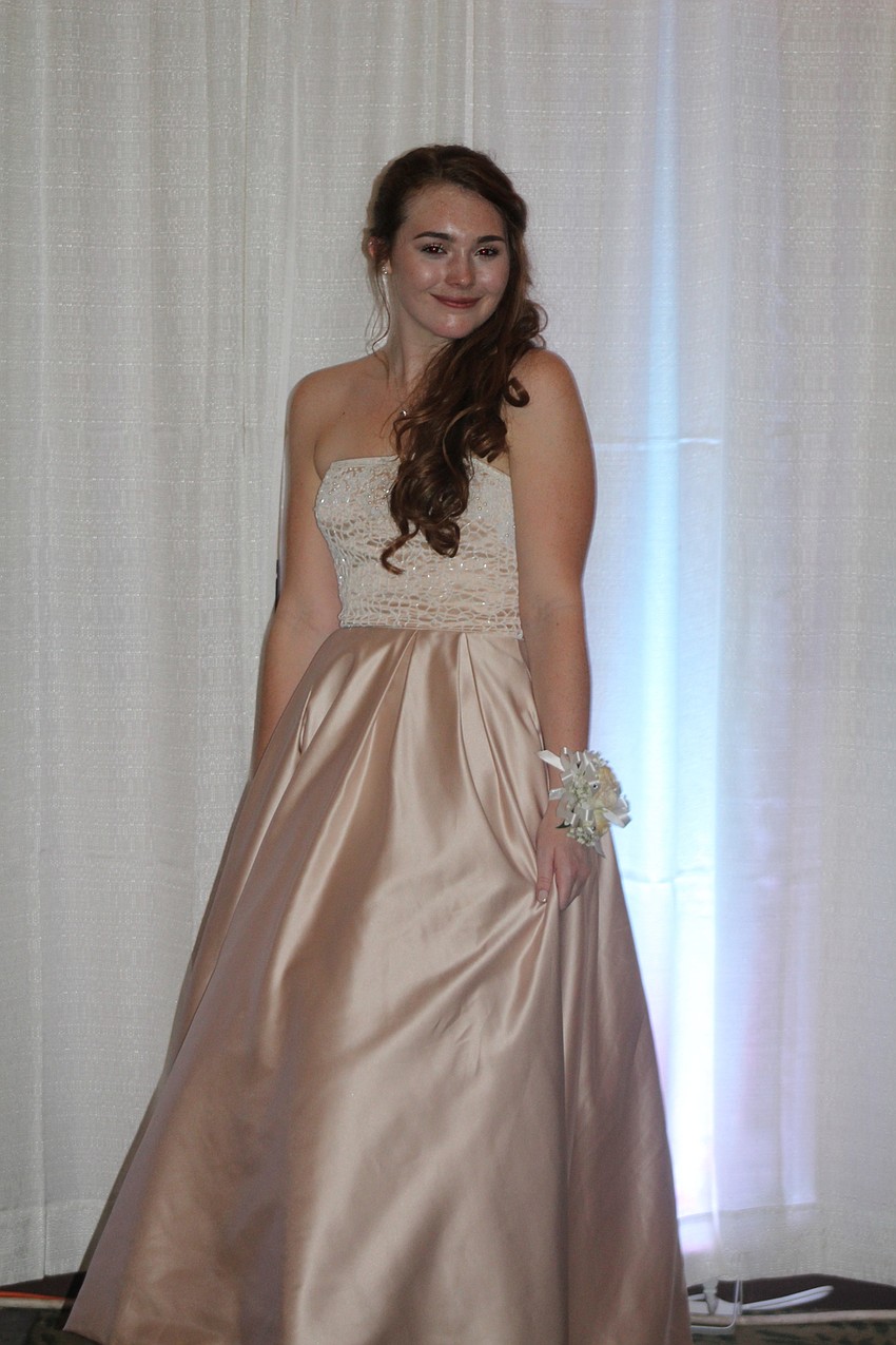 Braden River High School junior Madelynn Buckley shows off her ball gown during her high school prom.
