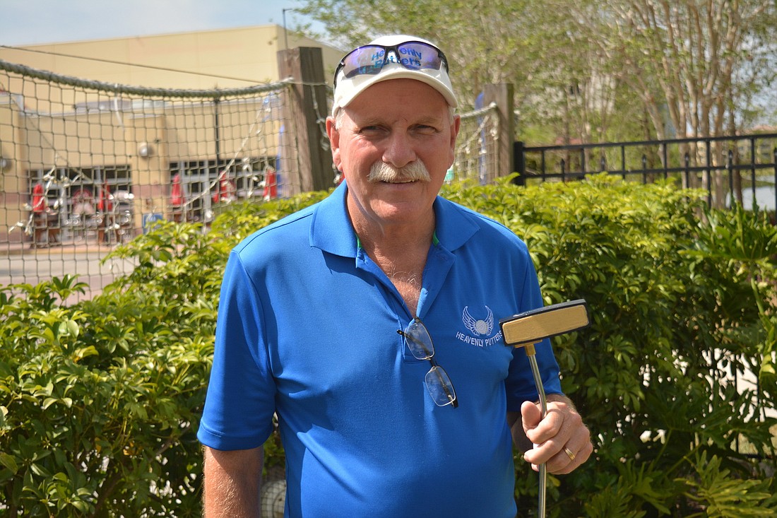 Peter Schrum and one of his Heavenly Putters clubs.