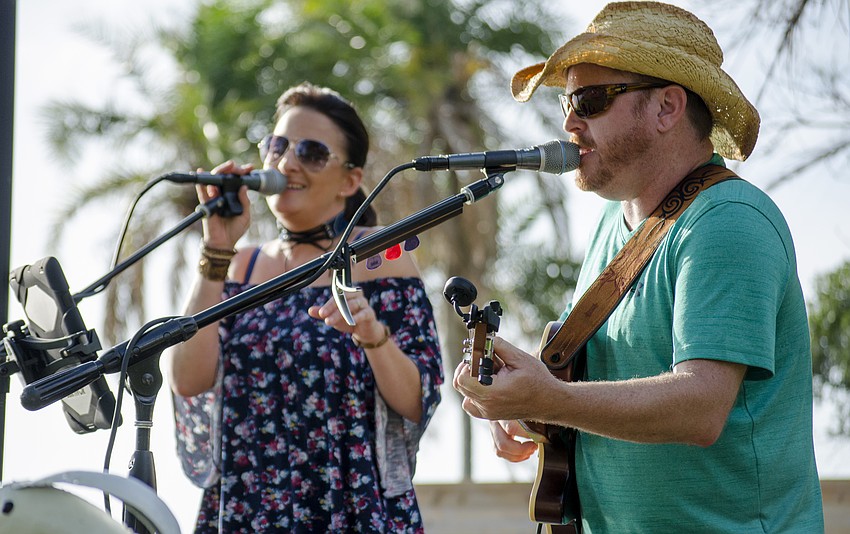 Stacey Jo Conner  and Brad Conner of Blue Mason Barter perform during the event.