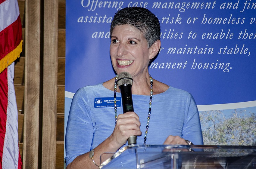 JFCS CEO Heidi Brown recognizes past Service to Community award recipients.