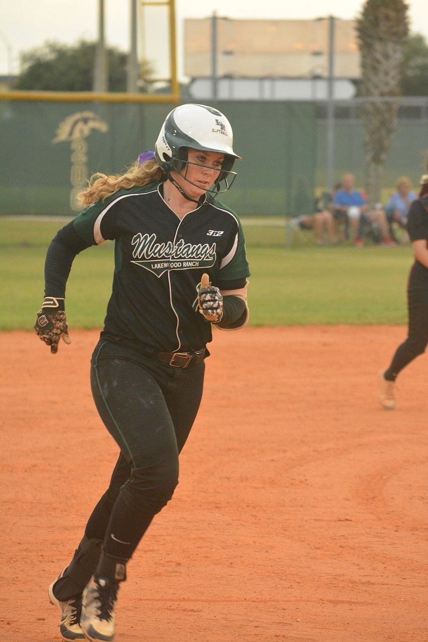 Morgan Cummins rounds the bases after her two-RBI home run in the third inning.