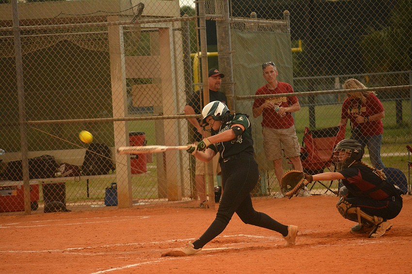 Madi LoCastro lines a single to left field.