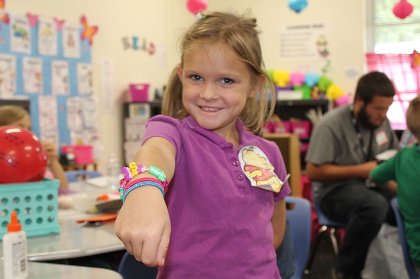 Bashaw Elementary School kindergartner Leslie Garber shows off her brand new friendship bracelet.