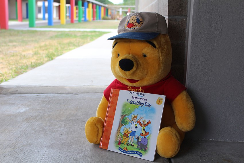 Winnie the Pooh sits outside at Bashaw Elementary School during the Winnie the Pooh and Shakespeare Too event.