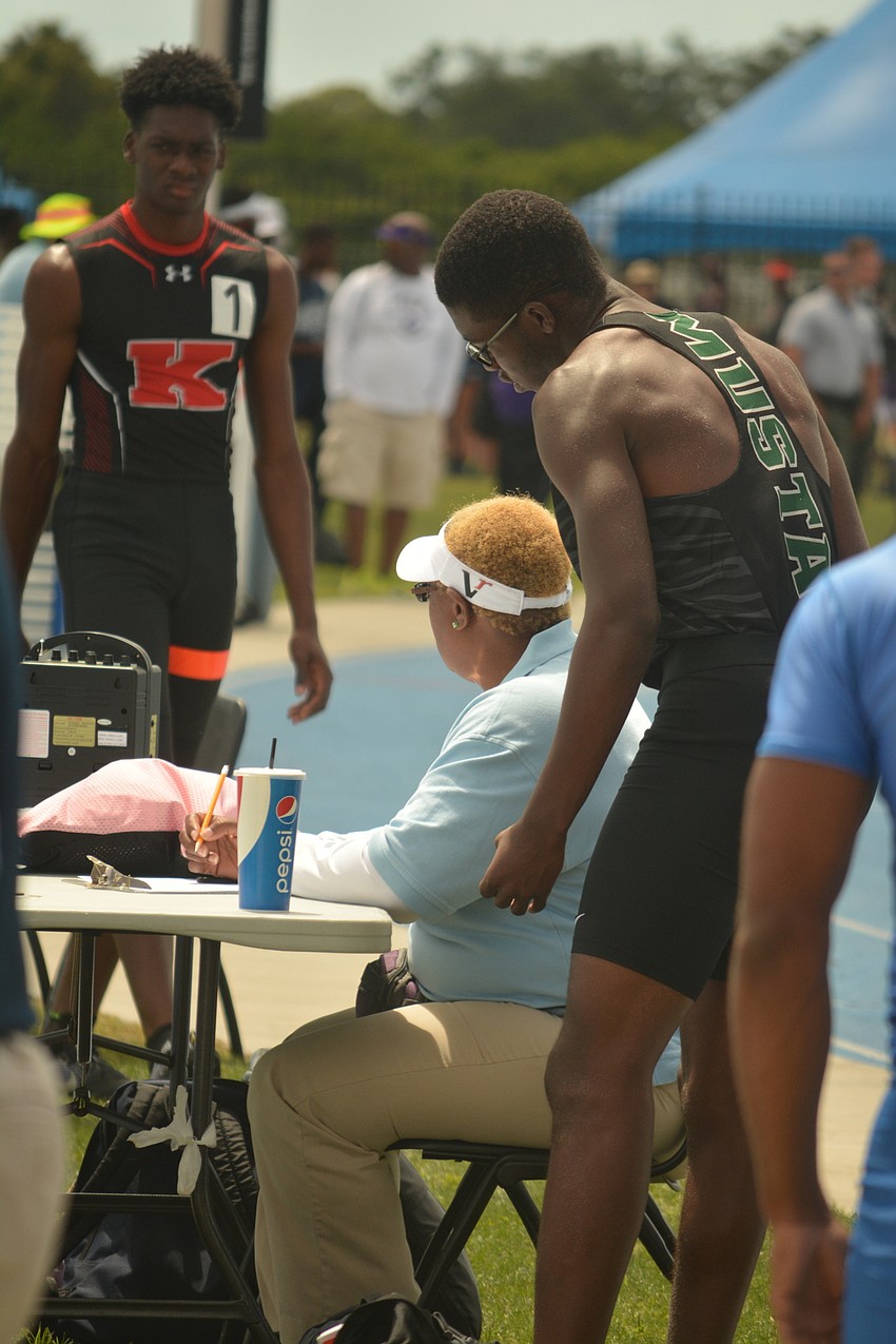 Lakewood Ranch'  s Harry Barthelemy checks his score in the Class 4 boys long jump. He finished eighth (6.54 meters).