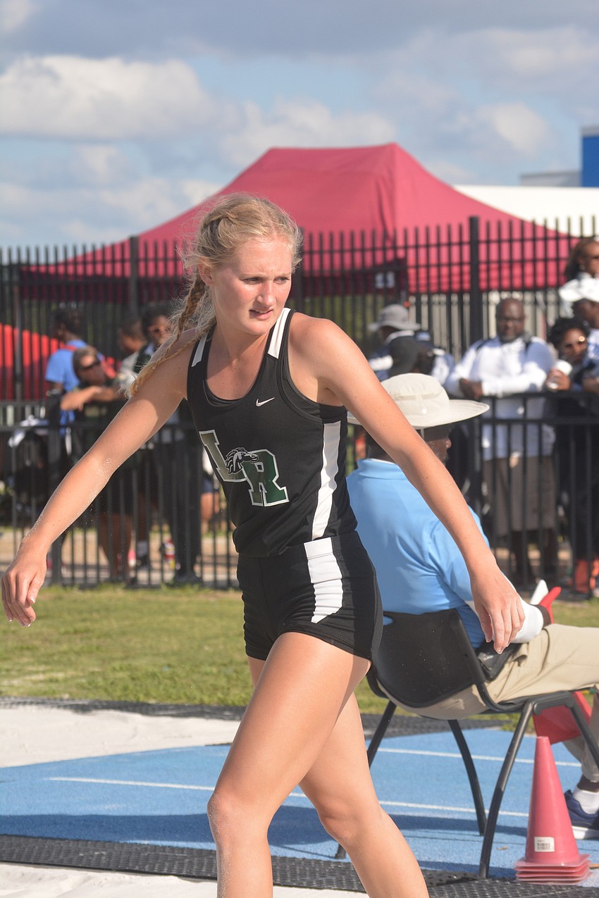 Lakewood Ranch senior Sophia Falco turns to check her landing spot during the Class 4 girls long jump.