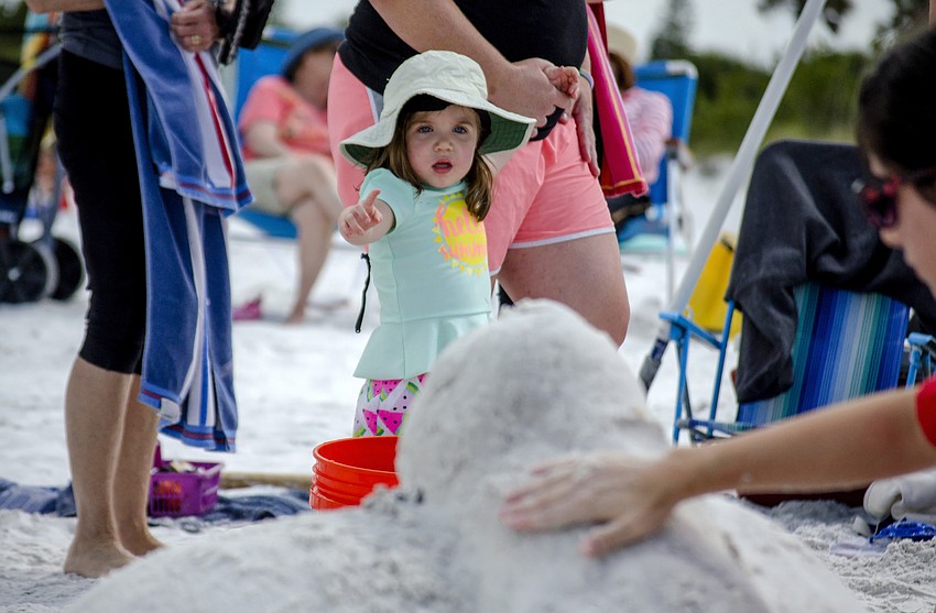 Sadie Smith points as the sand sculptures near the halfway mark in the competition.