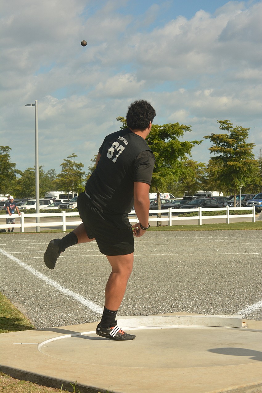 Lakewood Ranch'     s Sam Jackson watches hit shot put attempt.