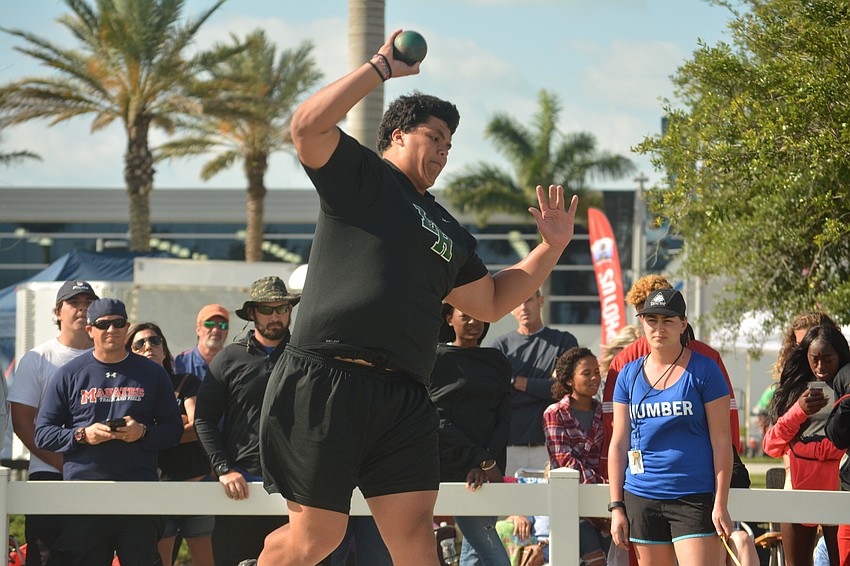 Lakewood Ranch'     s Sam Jackson puts all his might behind a shot put attempt.
