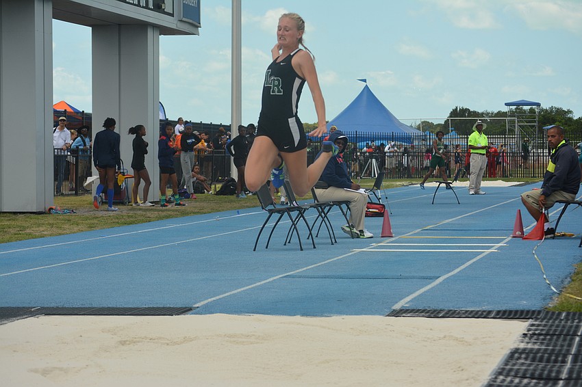Lakewood Ranch'     s Sophia Falco zooms through the air during the triple jump. She won the event, leaping 13 meters.