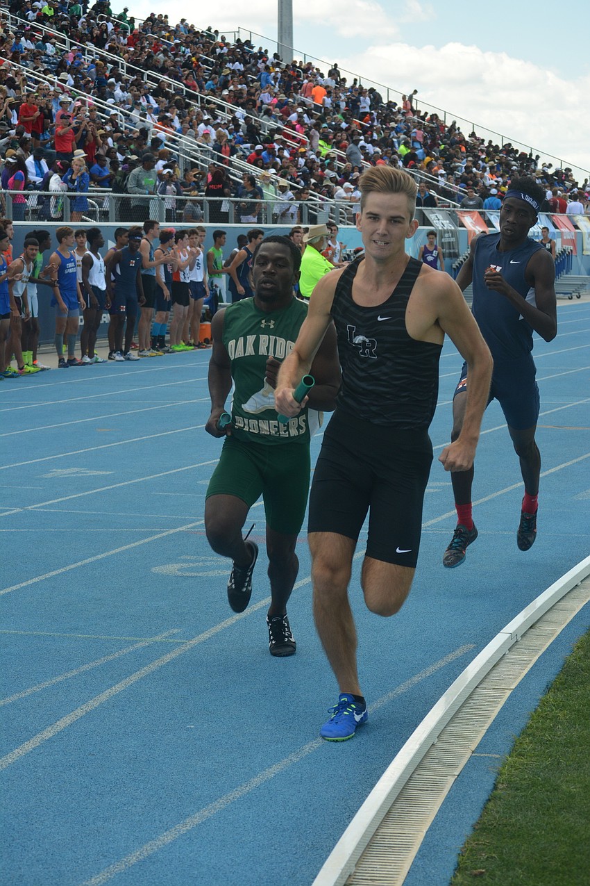 Lakewood Ranch'     s Andrew Dean gets ahold of first place for his team during the boys 4x800 relay.