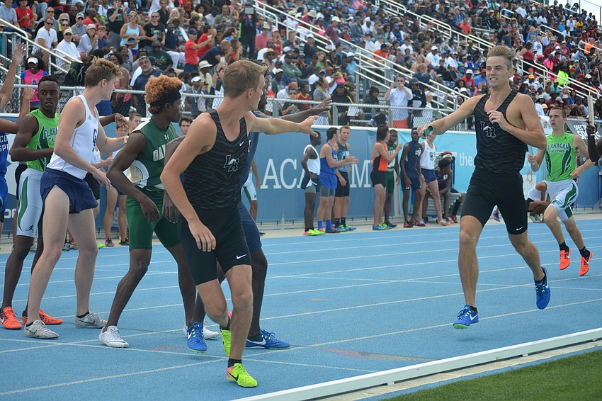 Lakewood Ranch'     s Brice Easton readies to take the handoff from Andrew Dean in the boys 4x800 relay.