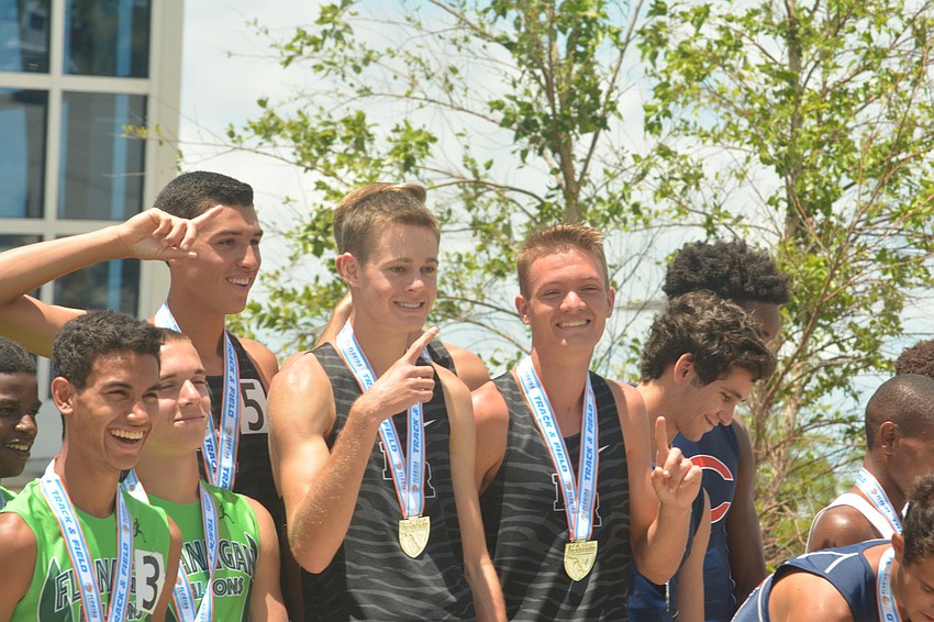Lakewood Ranch'     s John Rivera, Johnny Reid and Brice Easton take the medal stand following the boys 4x800 relay.
