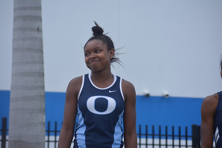 ODA'     s Saraiah Walkes makes a face after an announcer mispronounces her name on the medal stand.