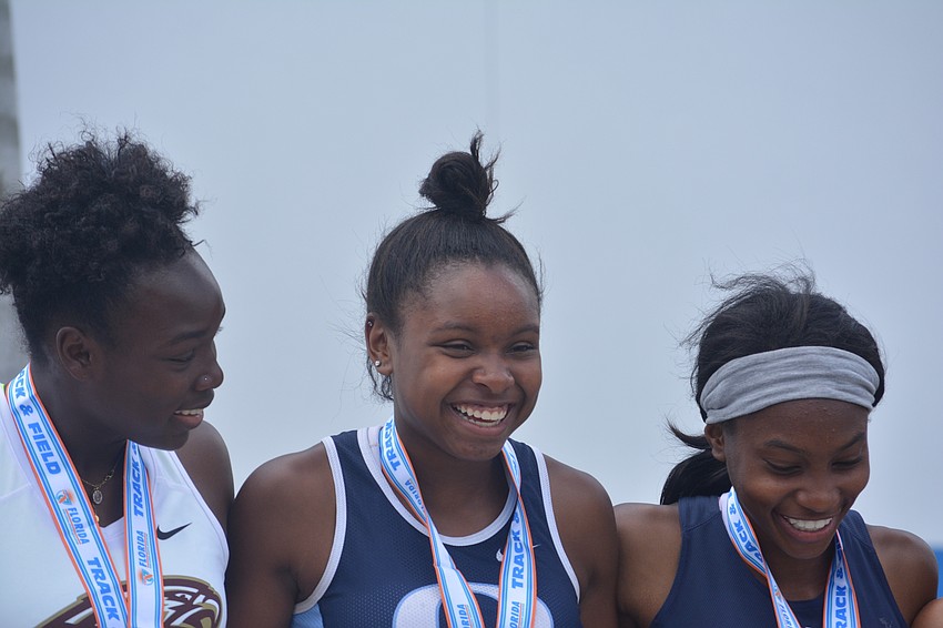 ODA'     s Saraiah Walkes smiles bright after receiving her Class 1A girls 100 meter dash medal.