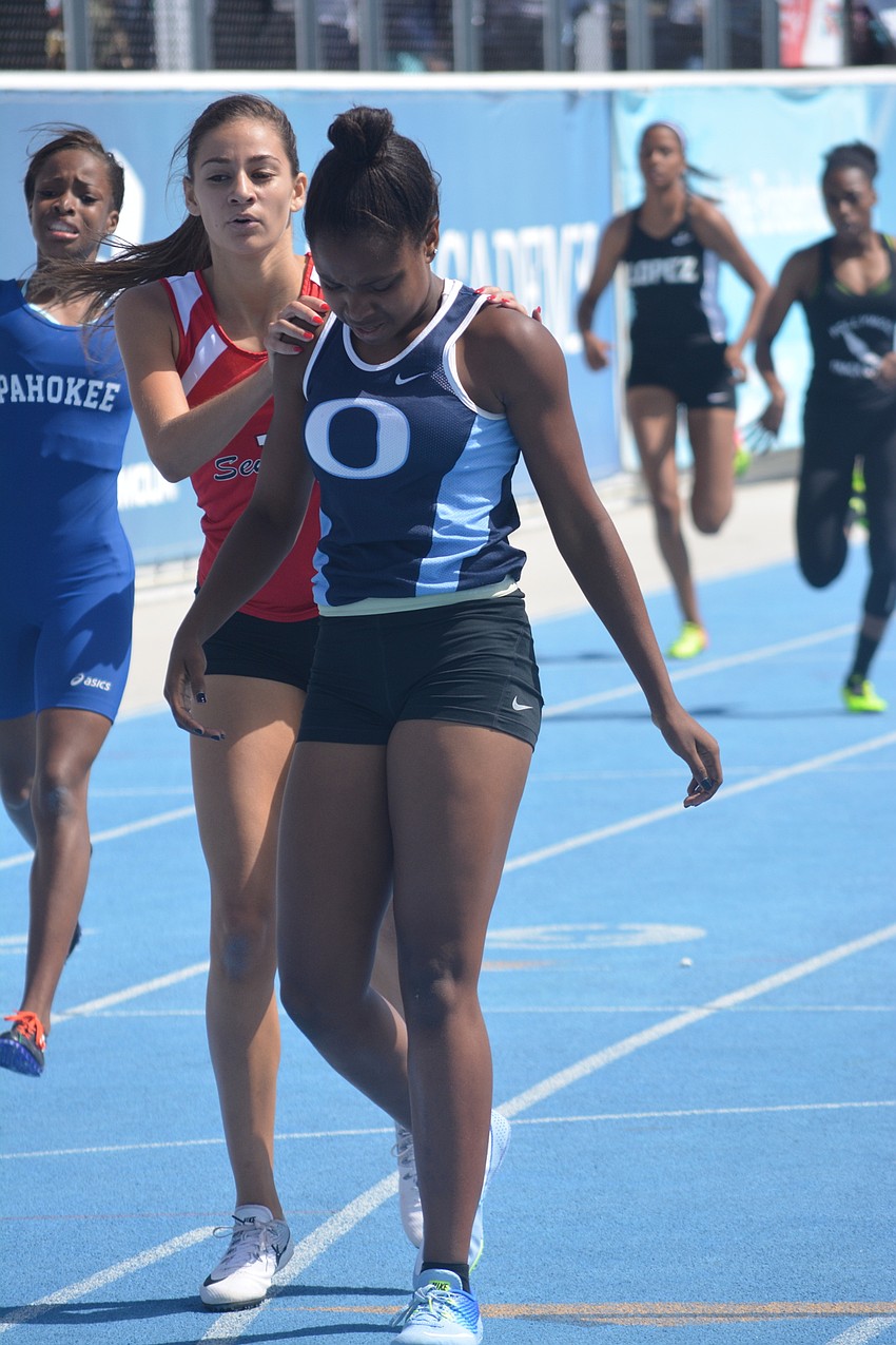ODA'     s Saraiah Walkes gets a shoulder massage after winning the Class 1A girls 200 meter dash.