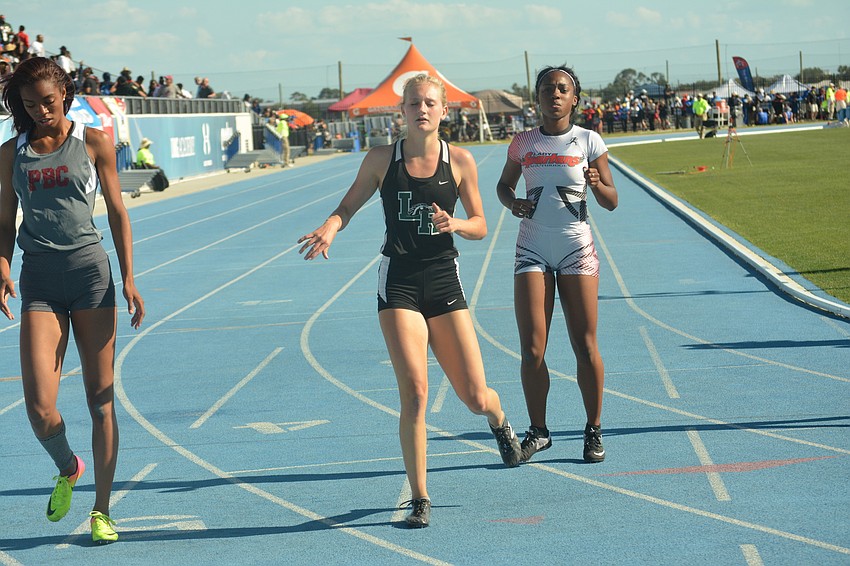 Lakewood Ranch'     s Sophia Falco crosses the finish line for the Class 4A girls 200 meter dash in third place.