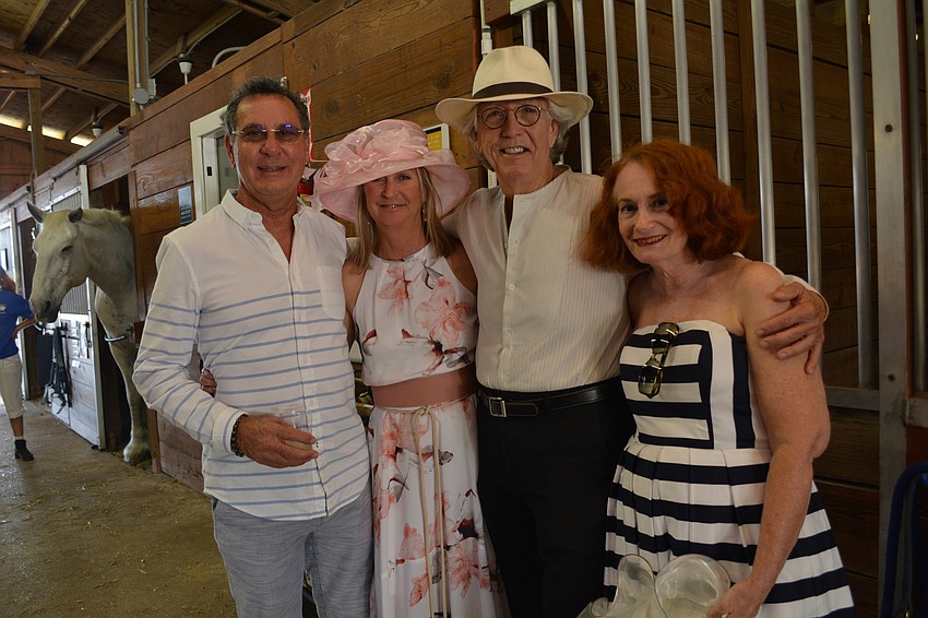 David and Julie Holt and Bill Anderson, of Bradenton, with Saraota'    s Deborah Greenleaf, whose daughter Mallory Schmidt has been a SMART rider since 2000