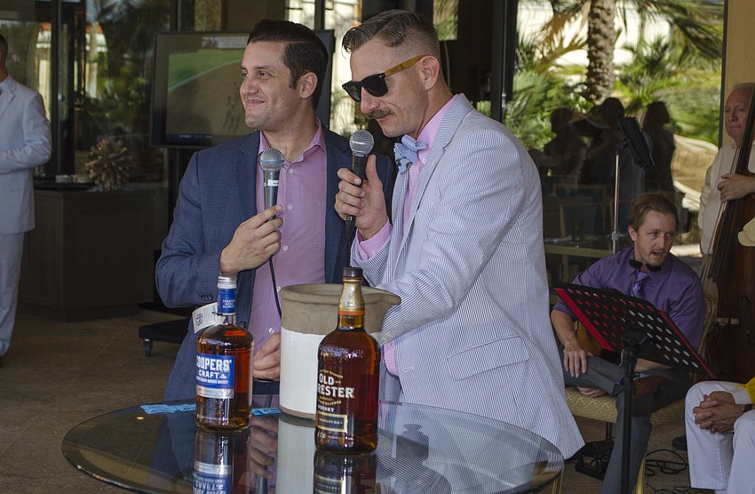 Jack Dusty General Manager Anthony Aviles and Woodford Reserve Ambassador Michael Ring pull raffle winners at Derby Day on May 6 at Jack Dusty.