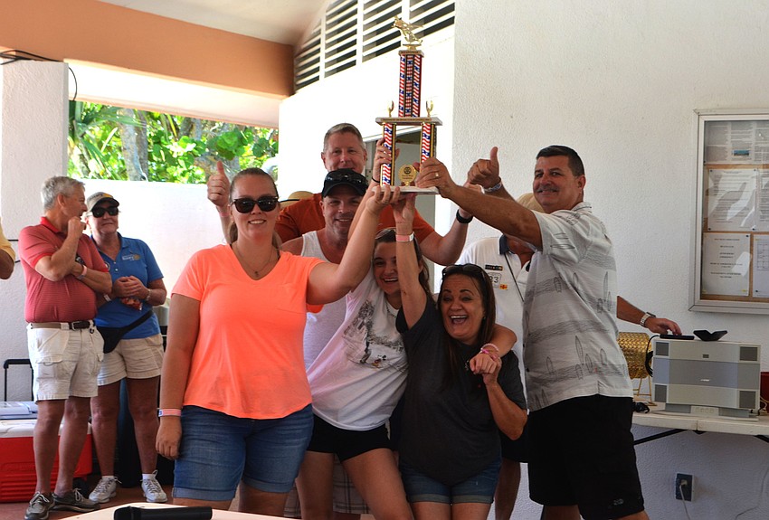 The police department celebrates its tug of war win.