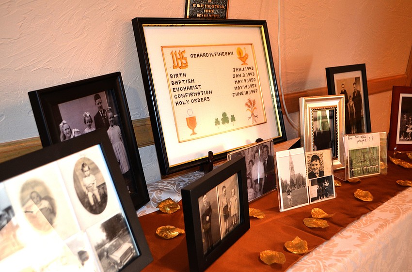 Various pictures lined the fellowship hall foyer for guests to look at as they arrived at the reception.