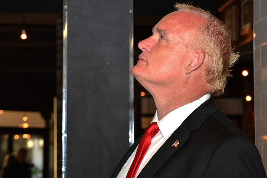 Martin Hyde watches as voting results come in. He lost a seat on the Sarasota City Commission in Tuesday’s runoff election against Hagen Brody and Jen Ahearn-Koch.