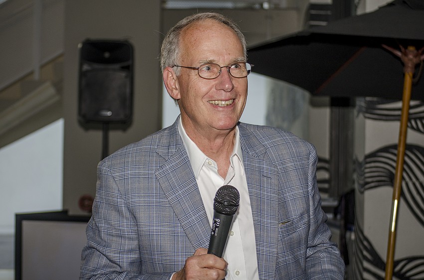 John Patterson smiles after announcing early results putting incoming City Commissioner Hagen Brody in the lead for two at-large seats on the Sarasota City Commission.