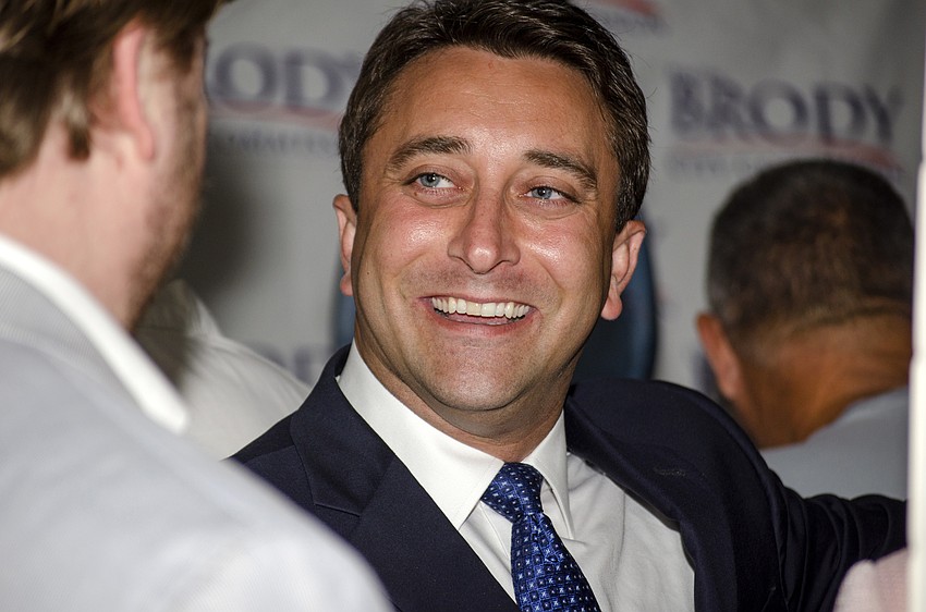Incoming City Commissioner Hagen Brody welcomes supporters to his watch party at Louies Modern.