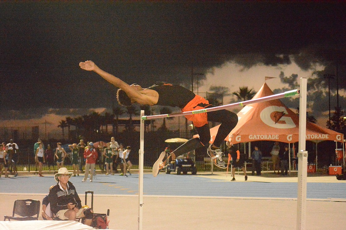 Jaasiel Torres jumps the bar at the state meet.