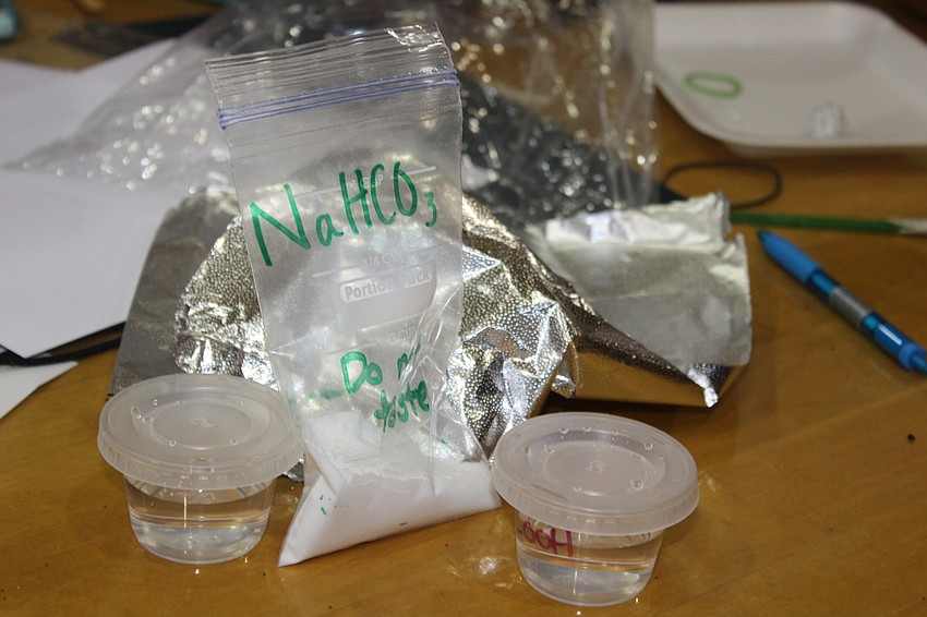 Material used for a balloon challenge lay out on Braden River Middle School'  s gym floor during STEAM Olympics.