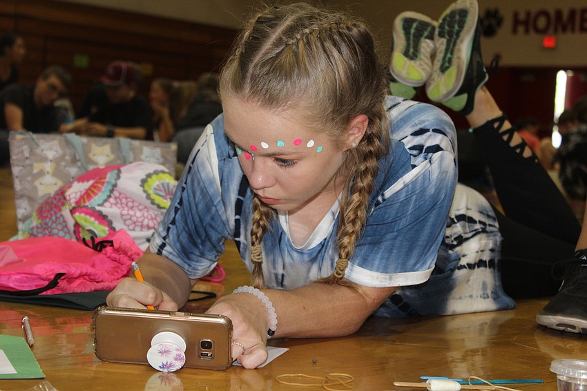 Braden River Middle School seventh-grader Kaylyn Shippey sketches a Celtic knot during STEAM Olympics.