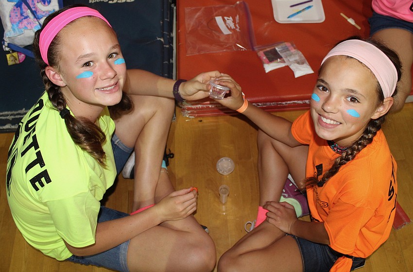 Braden River Middle School sixth-graders Kaitlyn Duquette and Kialy Stoker work on a challenge.