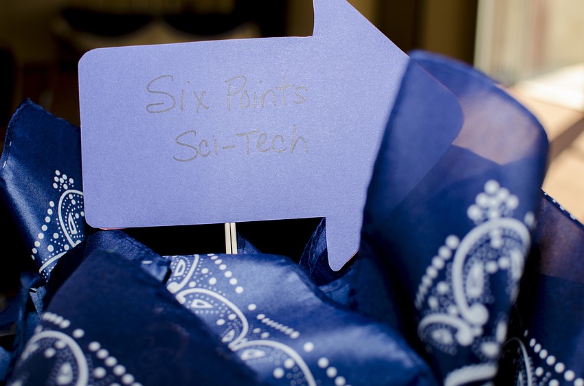 Tables were decorated with signs representing the camps Temple Sinai children will be attending this summer.