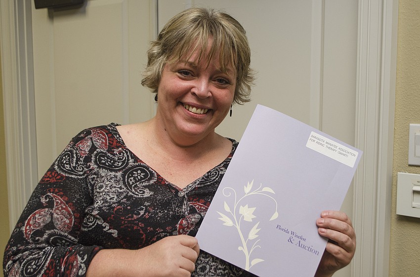 Brandi Ezell accepted the grant awarded to Sarasota Manatee Association for Riding Therapy (SMART) on May 11 at Community Foundation of Sarasota County.