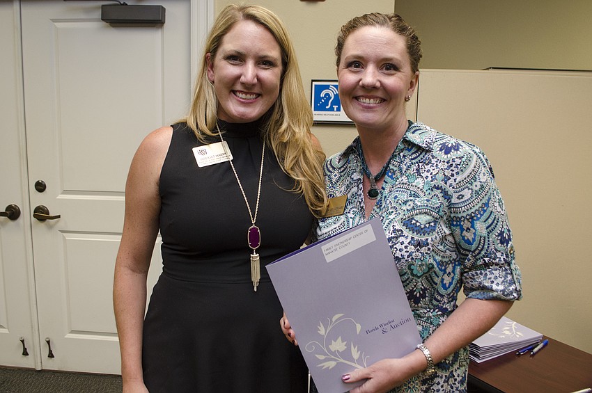 Bridget Harry and Katrina Bellemare accepted the grant awarded to Family Partnership Center of Manatee County on May 11 at Community Foundation of Sarasota County.