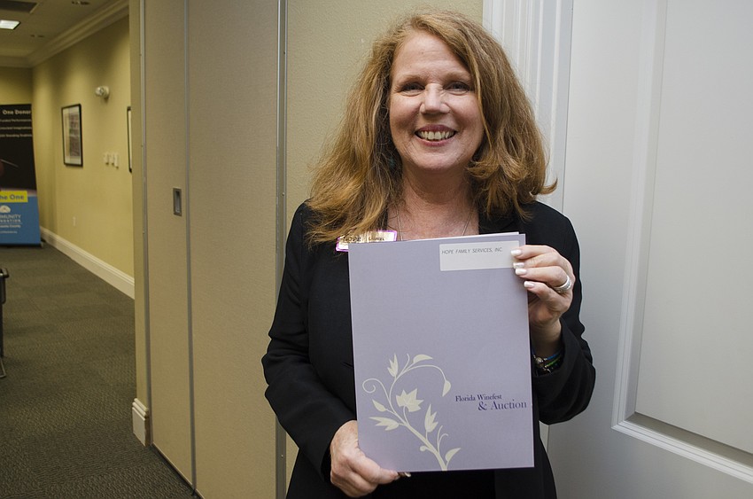 Laurel Lynch accepted the grant awarded to Hope Family Services on May 11 at Community Foundation of Sarasota County.