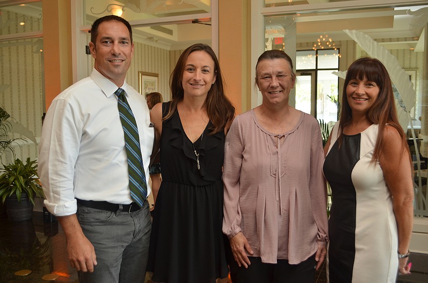 Dr. Jim Cocco, Ashlee Desoto, Julie Hagens and Diana Yoder; Desoto won a complimentary VIP Package that includes a one-night stay at The Resort for two.