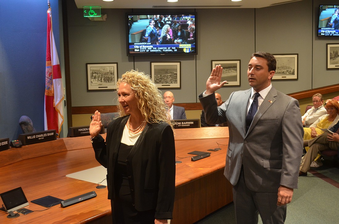 Jen Ahearn-Koch and Hagen Brody are sworn in as city commissioners Friday.