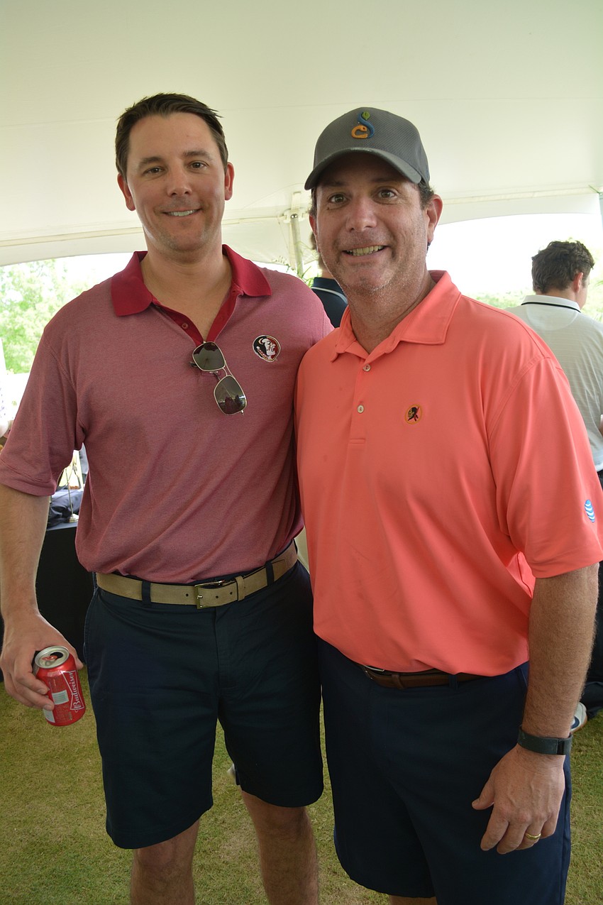Kevin Dempsey, of Citi Group, meets up with Chris Flack, of Duke Energy.