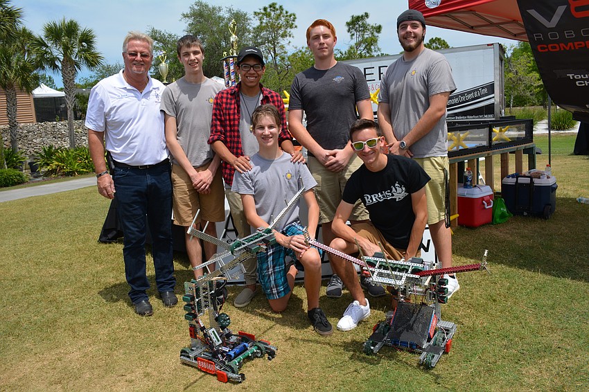 Braden River High School'   s robotics team shows off its robots. Clockwise from front left: Reid Kauffman, Gil Burlew, Brantley Deines, Jehzel Maldonado, Evan Lynch, Logan Miller and Jordan Conelias.