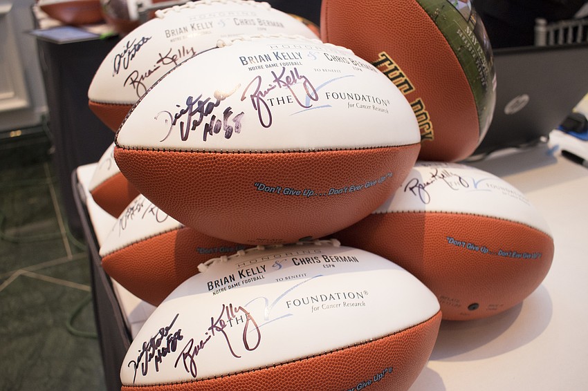 Guests could purchase footballs and basketballs autographed by the honorees — University of Notre Dame head football coach Brian Kelly, ESPN anchor Chris Berman and University of West Virginia head basketball coach Bob Huggins.