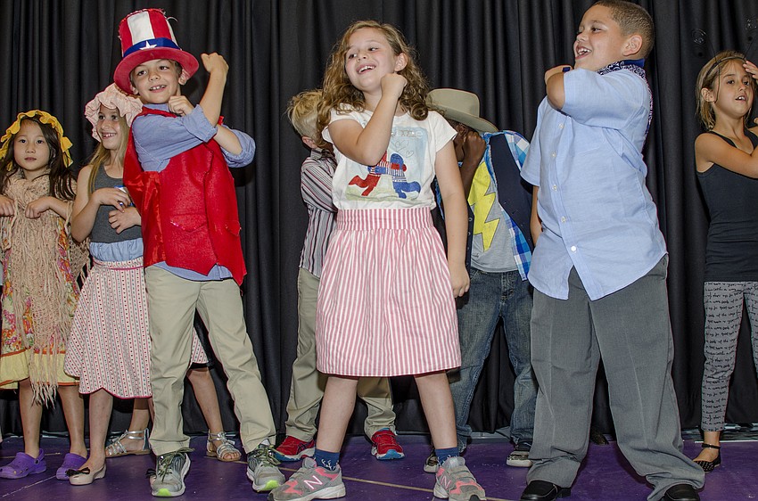 Nathaniel Parrott, Alina Sanchez and Giovanni Rivera perform a patriotic play at Hershorin Schiff Community Day School'    s Learning on Display night.