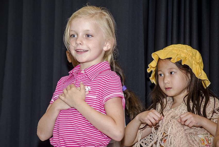 Mathilde Wesson performs a patriotic play at Hershorin Schiff Community Day School'    s Learning on Display night.