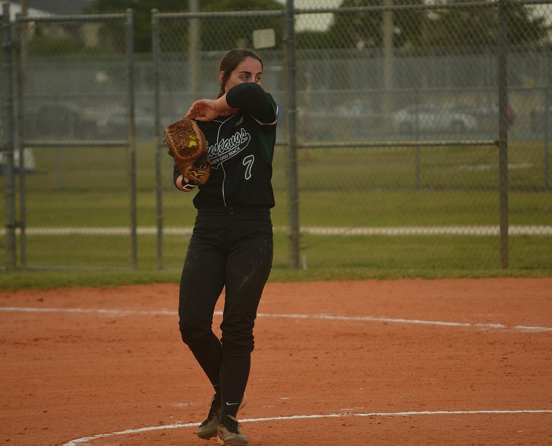 Lakewood Ranch&#39;  s Logan Newton wipes her face after throwing a pitch against Countryside.