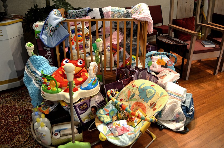 Congregants of the chapel donated items to go to Cyesis, a teen parent program at Riverview High School. A crib full of donations stood on the altar.