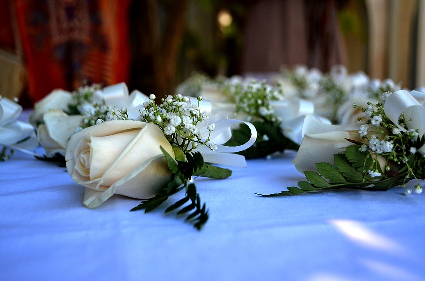 The scholarship recipients and their mothers wore boutonnieres.