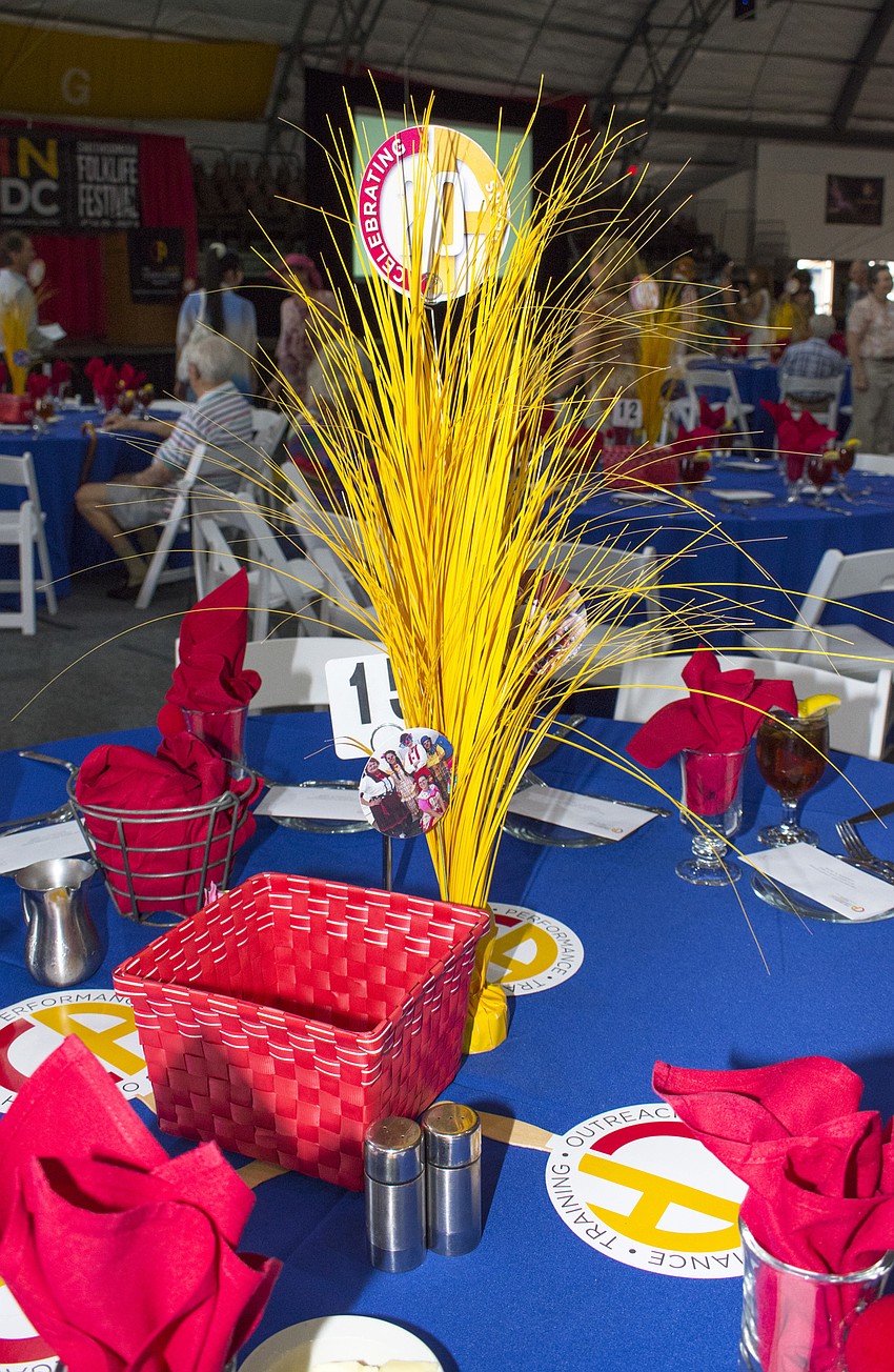 Every table was adorned with a colorful centerpiece and photos at La Cirque Appetit on May 16 at Sailor Circus Arena.