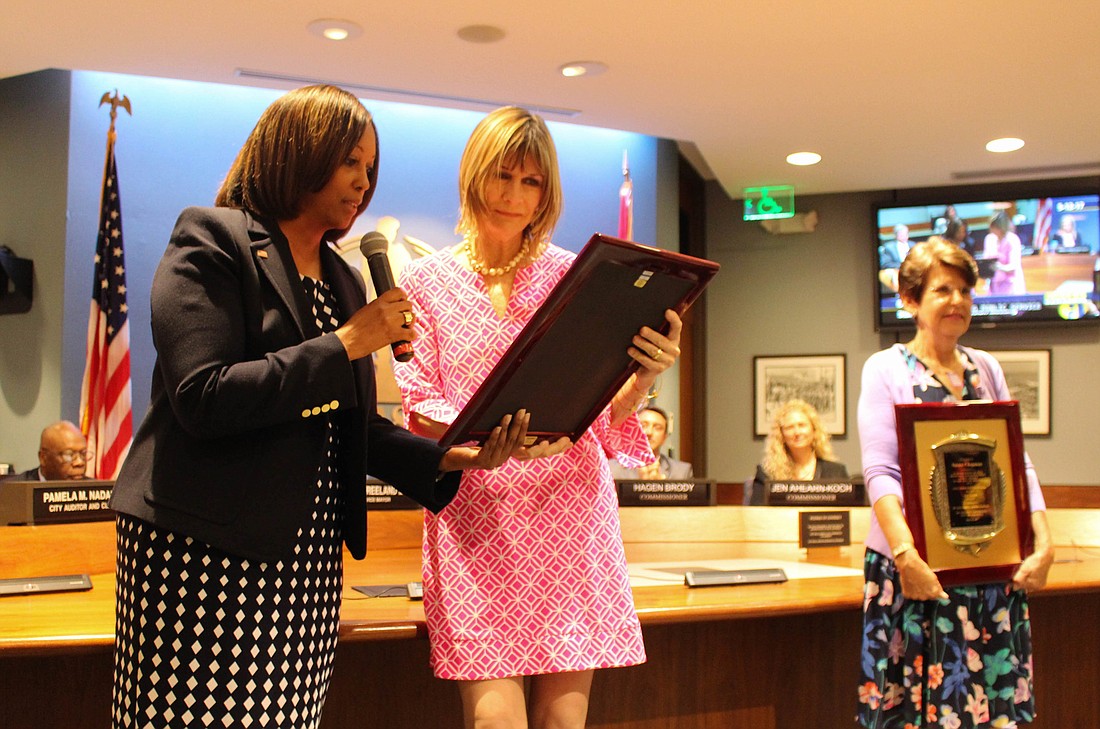 Mayor Shelli Freeland Eddie, left, honors outgoing Commissioners Suzanne Atwell, center, and Susan Chapman on Friday during their final commission meeting. Photo courtesy Jan Thornburg/City of Sarasota