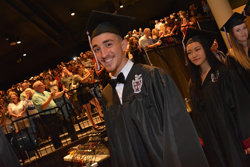 Braden River'     s Braden Large smiles as he walks into the ceremony.